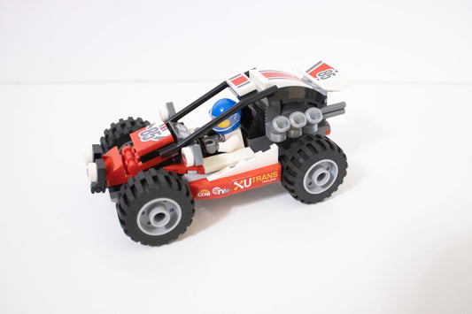 Toy vehicle made of interlocking bricks on a white background