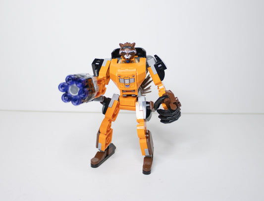 Toy figure of a robot with a weapon on a white background